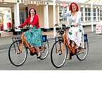 Tara Page and Emily Wilson, from Miss Molly in Worthing, help launch the bike hire scheme in Worthing - tile