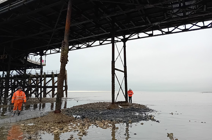 Worthing Pier - engineers under the pier inspecting the pier structure and piles (29-10-2024)